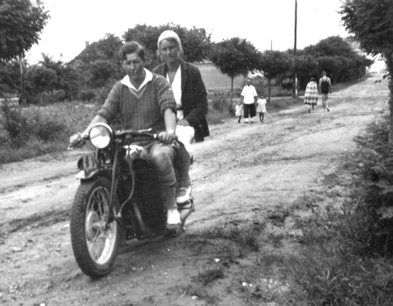 Proto of Missionaries Oscar and Hellen Rinell on motorcycle in Iltis Huk, Tsingtao, China, circa 1939